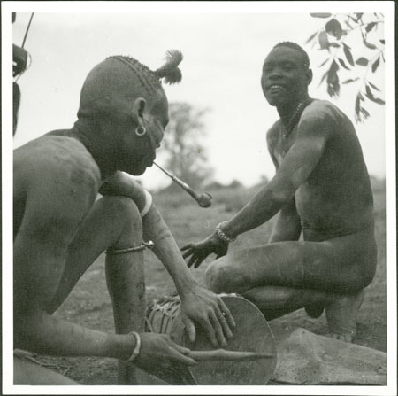 Mandari youths playing drums