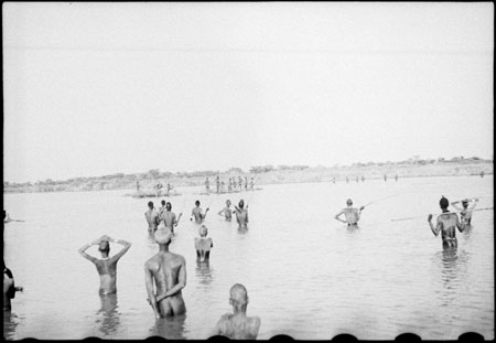 Nuer men hunting hippo