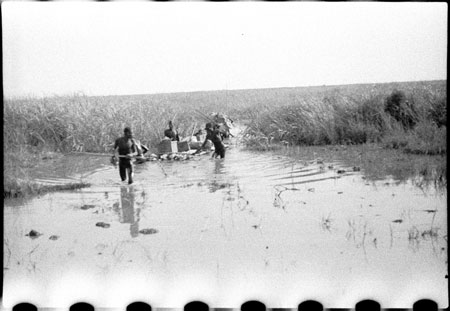 Nuer porters rafting baggage