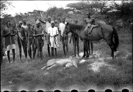 Nuer porters with lion