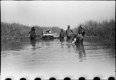 Nuer porters rafting baggage