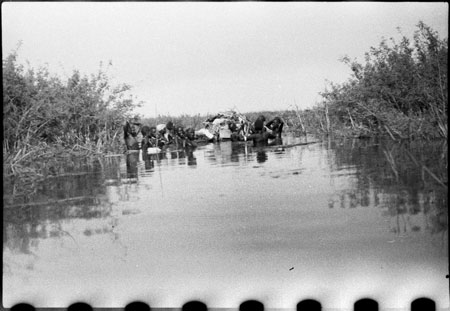 Nuer porters rafting baggage