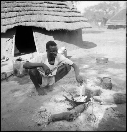 Dinka youth cooking