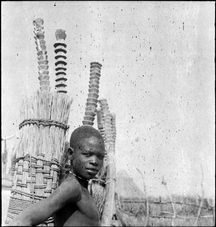 Anuak boy at homestead entrance