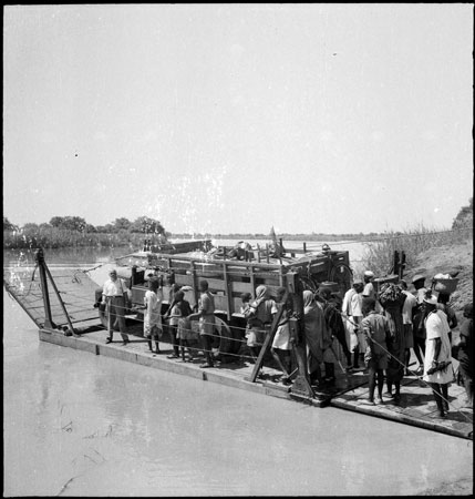 Truck boarding river ferry