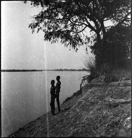 Dinka youths on river bank