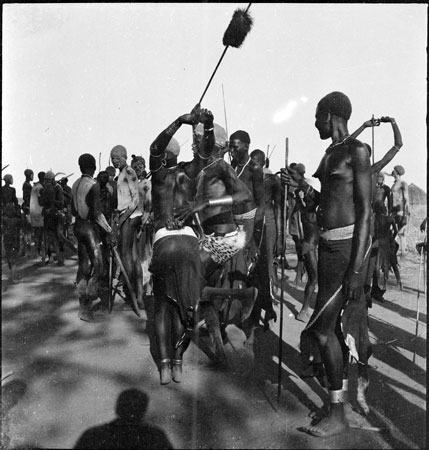 Dinka youth and girl dancing