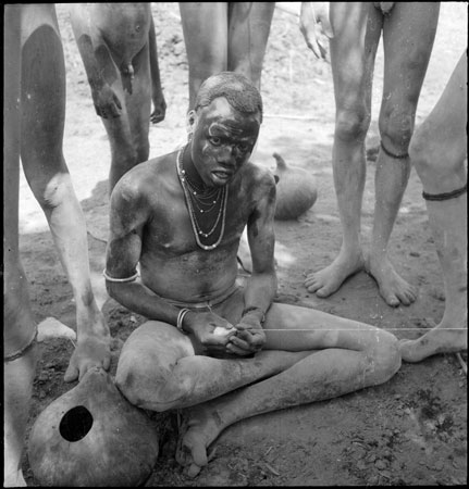 Dinka youth spinning yarn