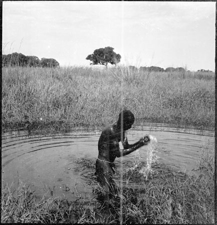 Dinka man bathing