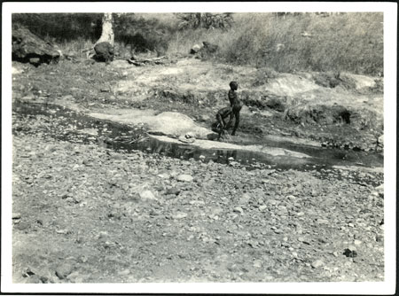 Ingessana boys washing in stream