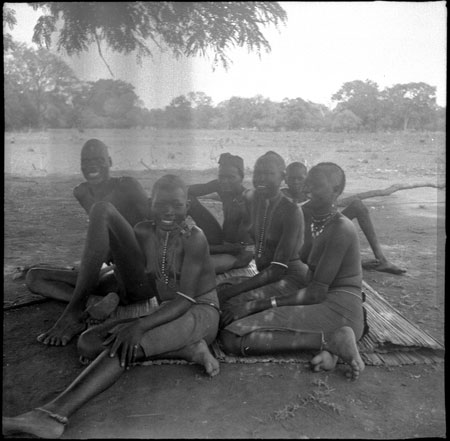 Mandari girls and youth resting in shade